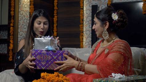 At gifts across india, we set our priority in delivering your heartiest emotions enfolded in gifts. Shot of Indian mother giving Diwali gifts to her daughter ...