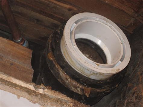How connect cast iron pipe hub to a pvc pipe using rubber gasket. 4 inch lead elbow connection to a 4" cast iron stack has ...