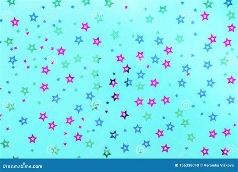 Multicolored Stars Sprinkles On Pastel Blue Backdrop Festive Holiday