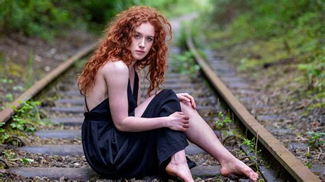Redhead Curly Hair Girl Model Is Wearing Black Dress Sitting On Railway Track Hd Girls