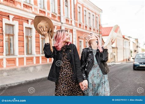 Happy Sisters With Pink Hair In Stylish Summer Dresses In Fashionable