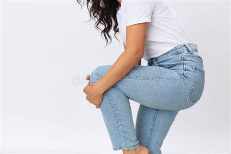 Woman Leg And Knee Pain Leg Injury Sprained Joints And Ligaments Wearing Jeans And A White T