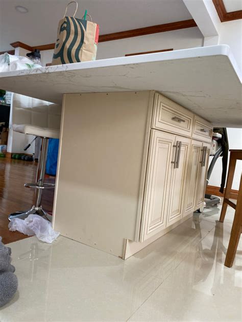 Measure the top of your cabinets and purchase your quartz slabs. quartz countertop overhang all sides