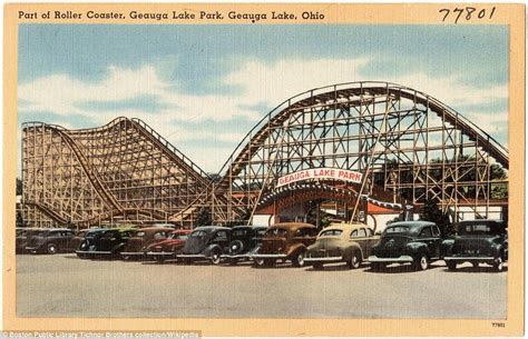An Amusement Park With Cars And Roller Coasters