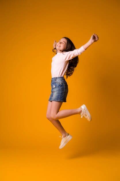 Premium Photo Kid Girl Jumping Happy Girl Dancing