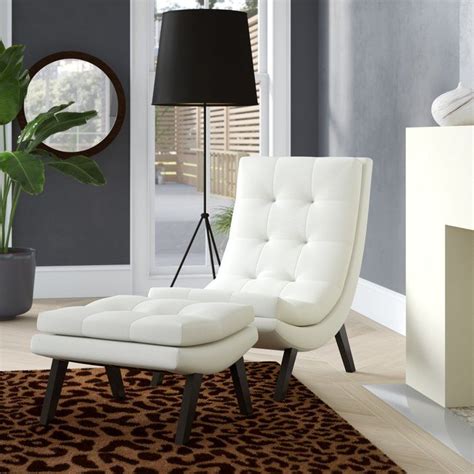 The bladen casual faux leather chair & ottoman, made by signature design by ashley, is brought to you by value city furniture. Woodbine Slipper Chair and Ottoman | Leather chairs ...