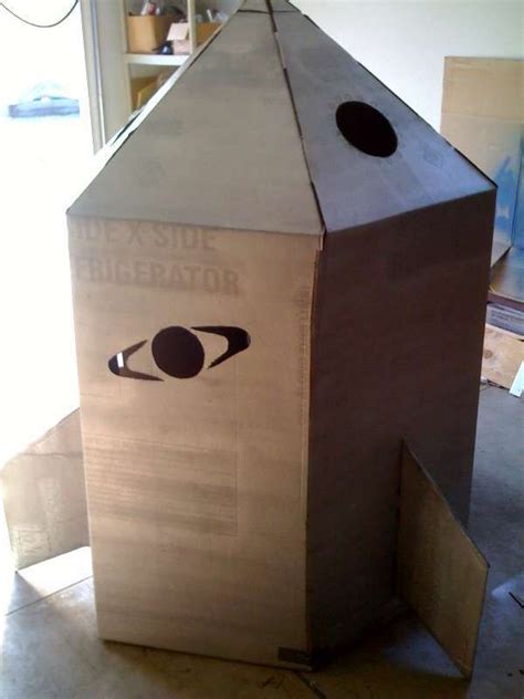 Now tape up the top of your rocket ship. How to Build a Cardboard Rocket Ship | Cardboard rocket ...