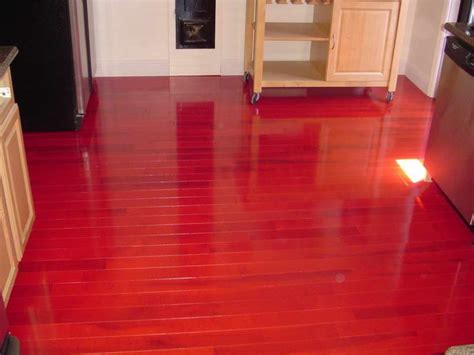 Shiny Red Hardwood Floor Color In Kitchen Area Equipped With Cart