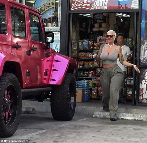 amber rose stops traffic in booty hugging trousers while hoppng into her hot pink jeep daily