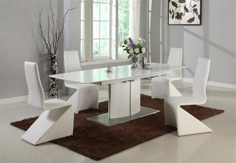 A beautiful home deserves a beautiful dining table where family and friends can get together. White Extendable Table with Self Storing Extension ...