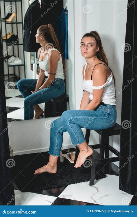 Shot Of A Beautiful Woman In The Fitting Room Stock Photo Image Of