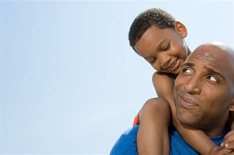 Son On Fathers Shoulders Stock Photo - Download Image Now - iStock