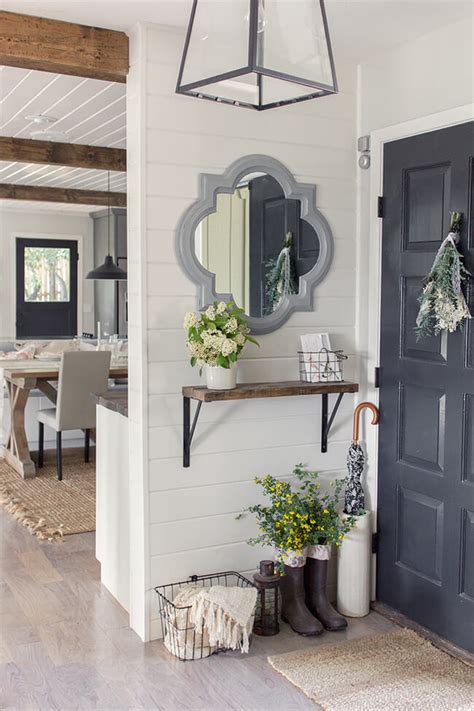 It should be hung so the tallest person in your house's eye level is 1/3 of the way down. 11 Best Entryway Mirror Ideas and Designs for 2020