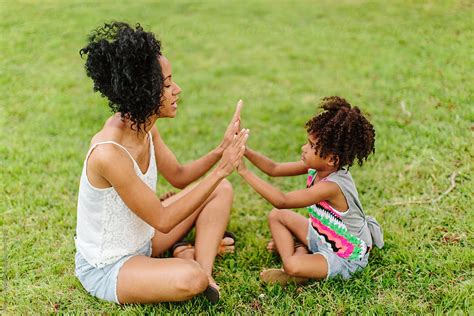 Mother And Daughter Playing Patty Cake At The Park Stock Image Everypixel