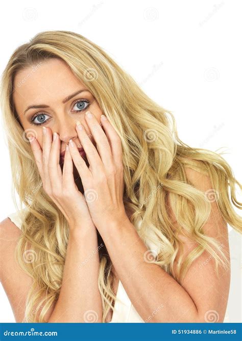 Shocked And Scared Frightened Young Woman Hiding Behind Her Hands Stock