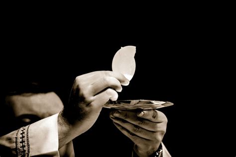 Print A Priest Holds Up The Eucharist Photo By Robert Cheaibcreative