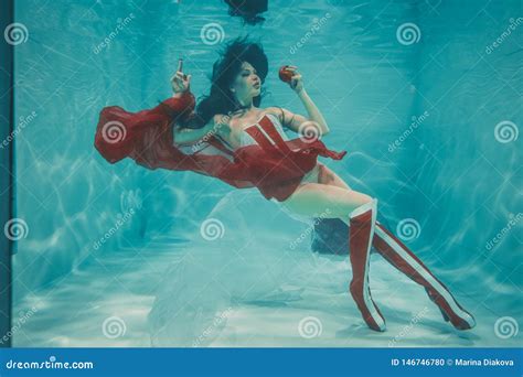 Hot Slim Brunette Woman Posing Swimming Under Water In Beautiful