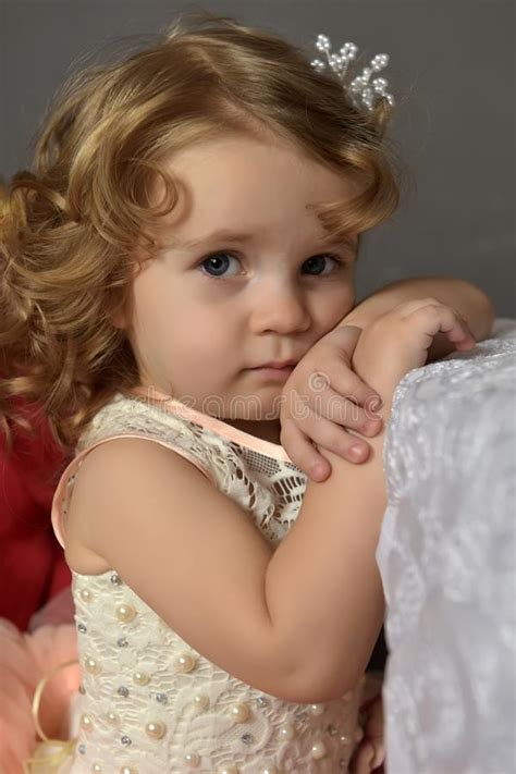Art Portrait Of A Pretty Little Girl Wearing Princess Dress Stock Photo