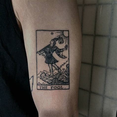 Explore cool masculine design ideas and manly body art styles. The fool | Tarot tattoo, Tarot card tattoo, Card tattoo