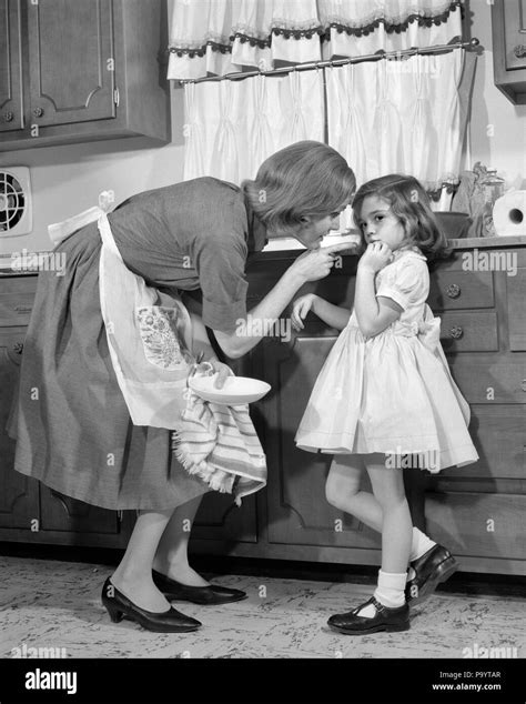 1960s Woman Mother In Kitchen Disciplining Girl Her Daughter J11946