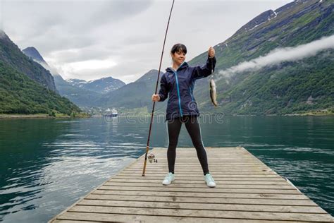 Woman Fishing On Fishing Rod Spinning In Norway Stock Image Image Of