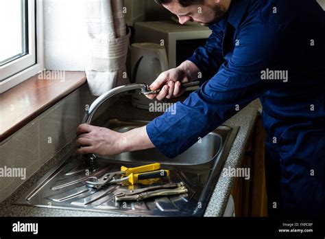 Plumber Fixing The Sink With Wrench Stock Photo Alamy