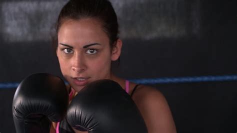 sporty focused brunette boxing in boxing ring stock footage video