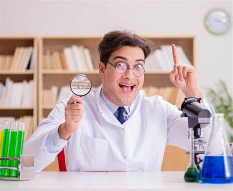 Mad Crazy Scientist Doctor Doing Experiments In A Laboratory Stock