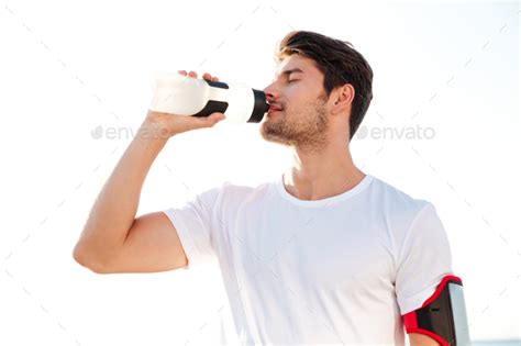 Thirsty Athlete Drinking Water After Workout Stock Photo By Vadymvdrobot