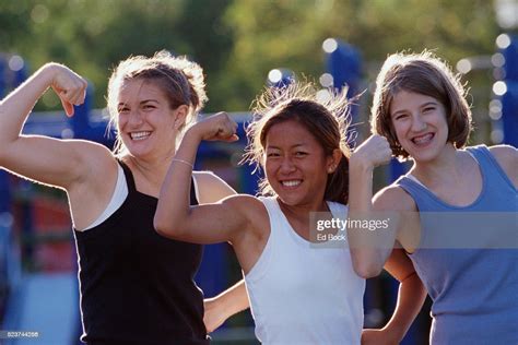 Girls Flexing Biceps Photo Getty Images