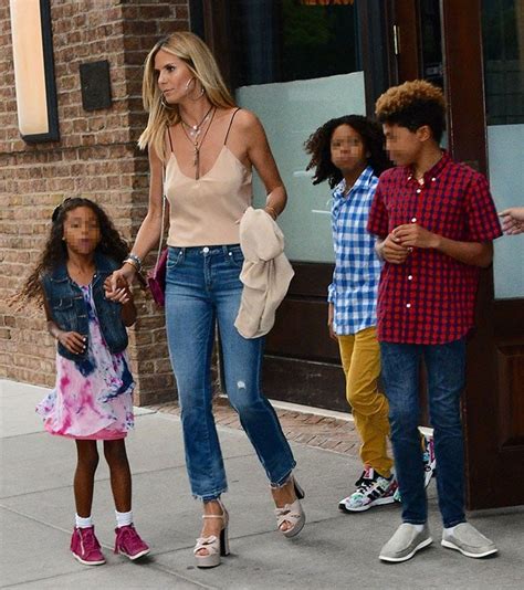 Model, tv personality and entrepreneur. Heidi Klum in Cropped AMO Jeans and Saint Laurent 'Candy ...
