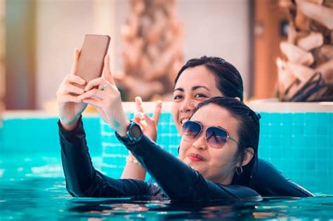 Friends Swimming And Taking A Selfie On The Pool Stock Image Image Of
