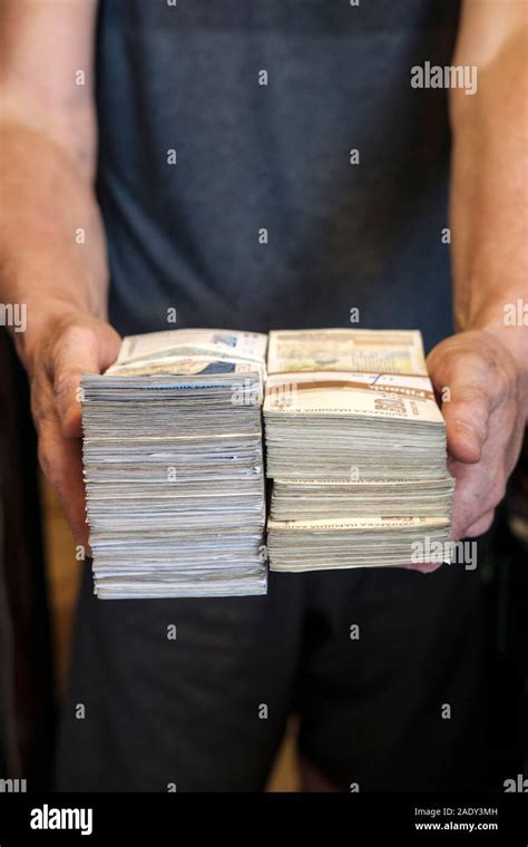 Man Holds Wads Of Cash Stock Photo Alamy