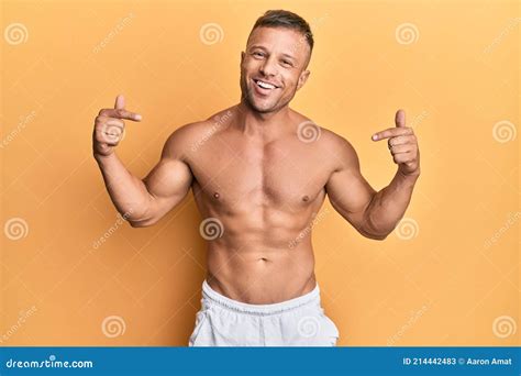 Handsome Muscle Man Standing Shirtless Looking Confident With Smile On Face Pointing Oneself