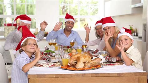 Cook a complete christmas dinner to enjoy yourself, including a stuffed chicken joint, rich sauces, roast veg and pigs in blankets. Happy Family Celebrating Christmas Around The Dinner Table Stock Footage Video 3001762 ...