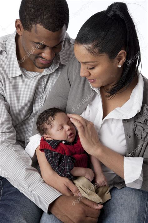 African American Mother And Father Holding Their Newborn Baby Boy