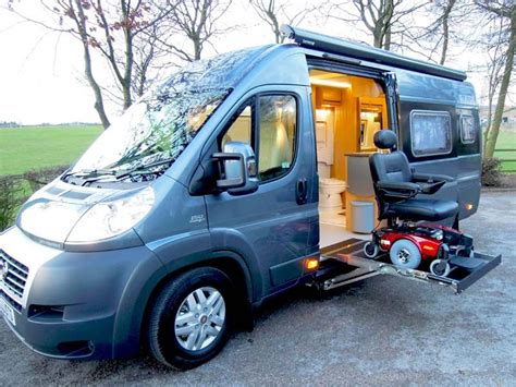 A Power Chair Being Lifted By The Side Access To A Motorhome