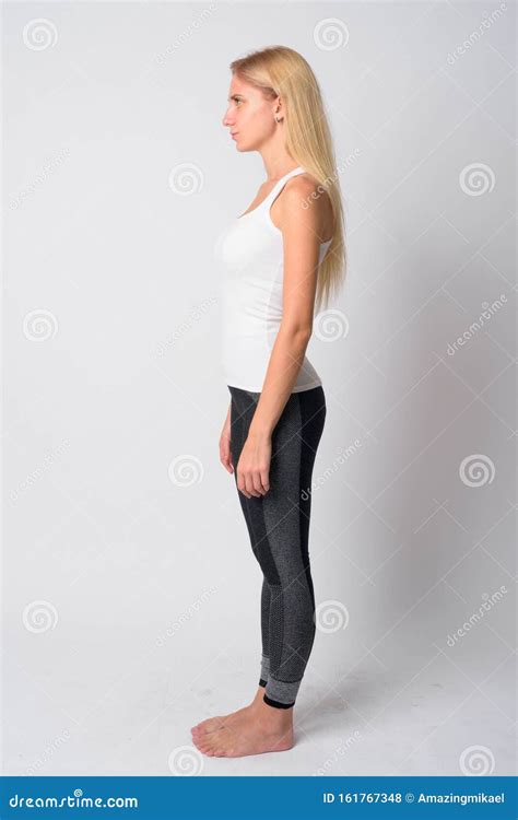 Full Body Shot Profile View Of Young Blonde Woman Ready For Gym Stock