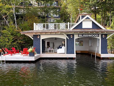 Boat House With Sitting Room And Deep Blue Wood Paneling Muskoka