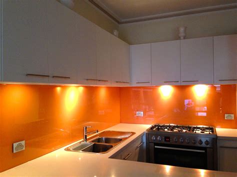 Orange Coloured Glass Splashbacks Are A Popular Choice Orange Kitchen Walls White Kitchen