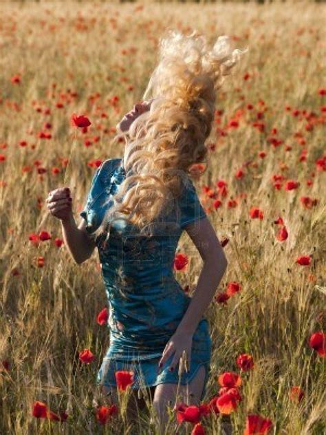 Beautiful Blonde Lady In Poppy Field Shaking Hair Beautiful Blonde