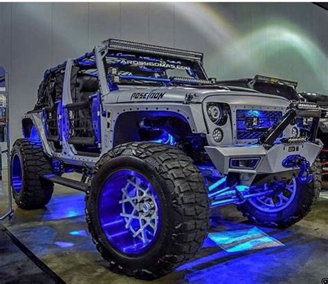 This Silver Jeep Jk Is Decked Out In Blue Lights And Blue Rims Not To