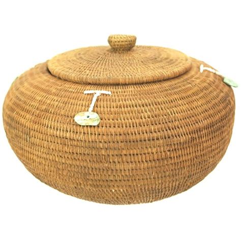 Finely woven coiled basket with lid and beaded