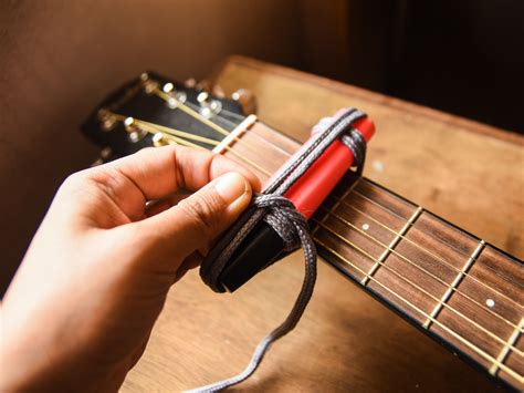 I lost my capo a couple of weeks ago, and i've been working on several songs that require one. How to Make a Capo with Office Materials: 6 Steps (with ...