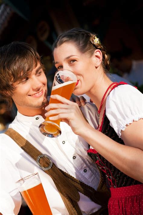 Couple In Bavarian Tracht Drinking Wheat Beer Stock Image Image Of Munich Festival 14664149
