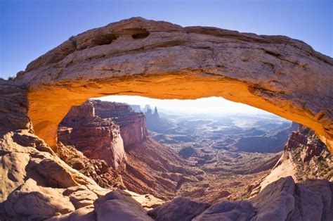 the mesa arch in canyonlands national park is the perfect place to look out over countless