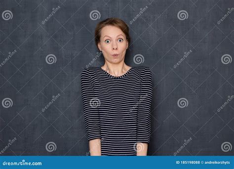 portrait of stunned woman taking off ring royalty free stock