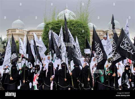 Female Protesters Seen Holding Flags During The Protest Muslims