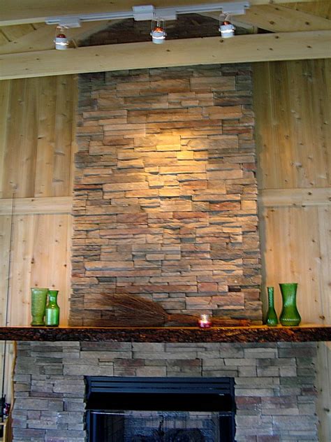 The stone hearth that is flush with the floor creates a seamless effect and keeps the fireplace open to the remainder of the room. Live Edge Mantle | Stacked stone fireplaces, Fireplace ...