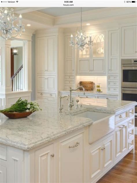Inspirational white kitchen cabinets with beige quartz countertops